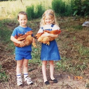 Rachel as a child holding a chicken